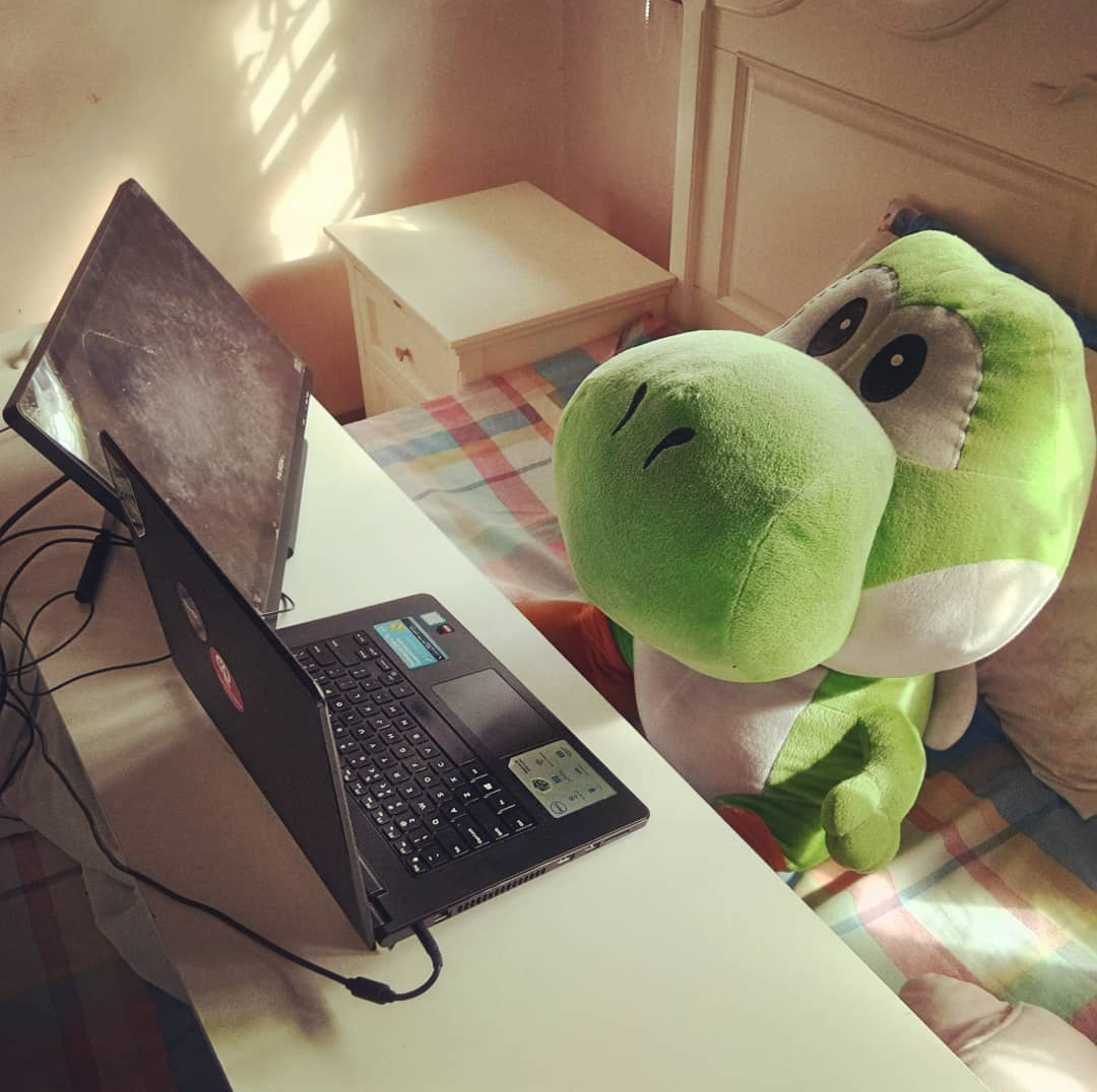 yoshi working behind the computer